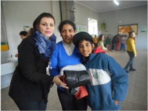 Entrega dos agasalhos para as famílias